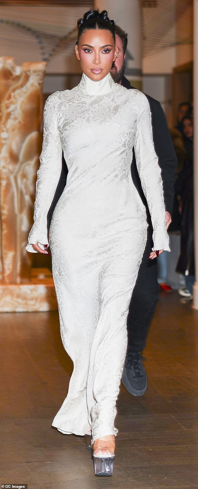 Kim relies on high heels to balance her curves and create vertical length. She often chooses clear heels