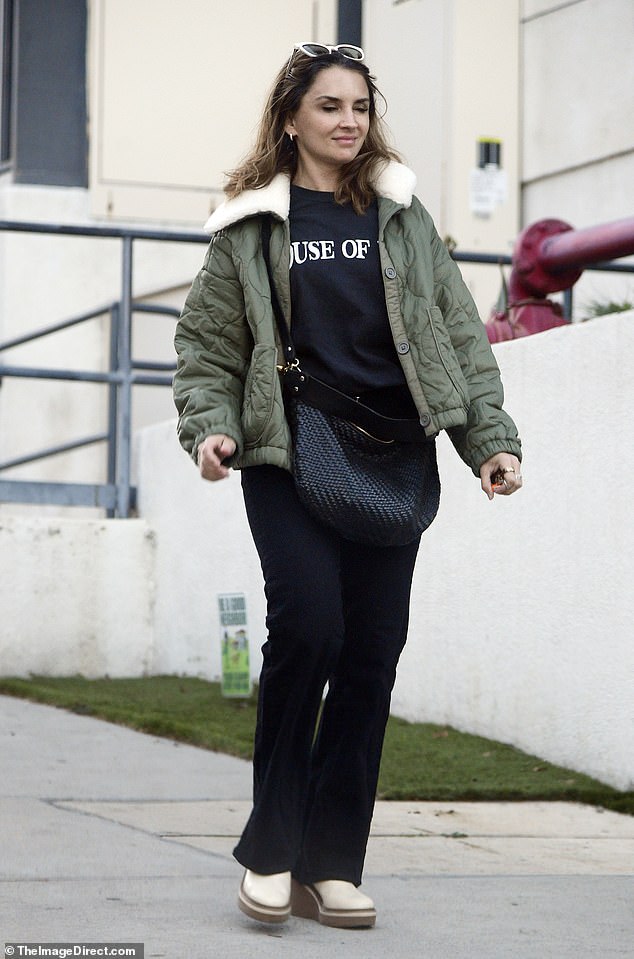 The 46-year-old actress was casually dressed in black trousers, a black T-shirt, and an olive green quilted bomber with a shearling collar