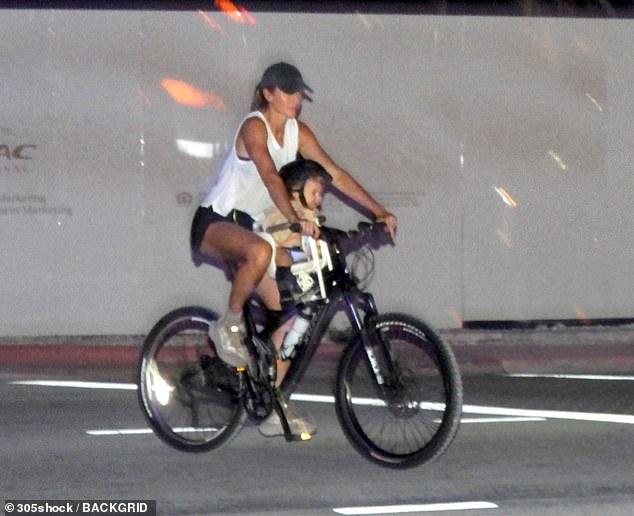 Gisele Bündchen proved she¿s embracing every moment of motherhood as she was spotted enjoying an adventurous family bike ride with her 11-month-old son