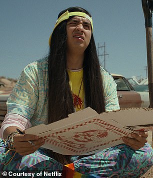 The actor pictured with a pizza box for his role in the hit Netflix series