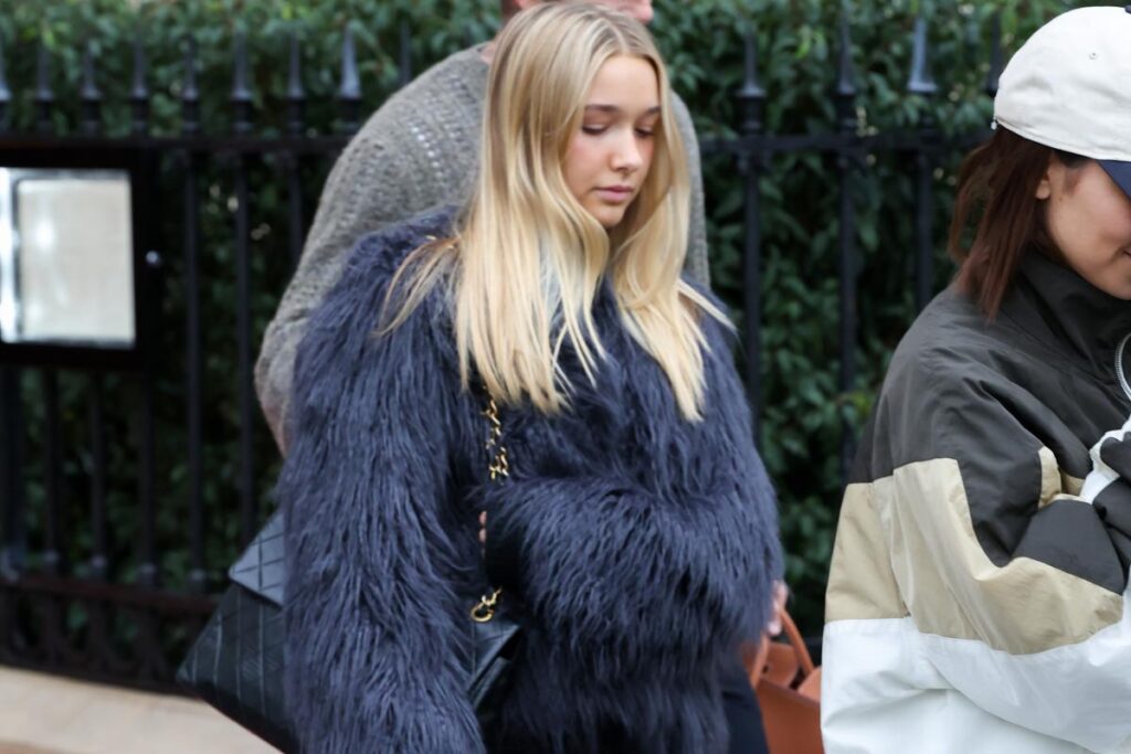 David and Victoria Beckham's 14-year-old daughter, Harper, bundles up in fur coat and $4K vintage Chanel bag