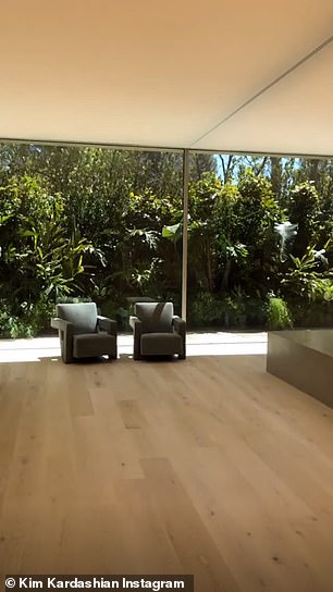 The massive shower has the same floor to ceiling glass walls, leaving little privacy for anyone who uses it
