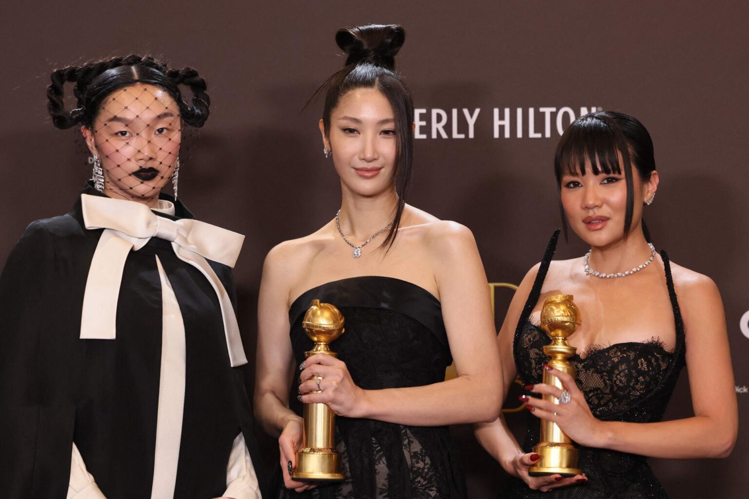 From left, Chris Appelhans, Maggie Kang and Michelle Wong, winners of the award for Best Motion Picture — Animated for