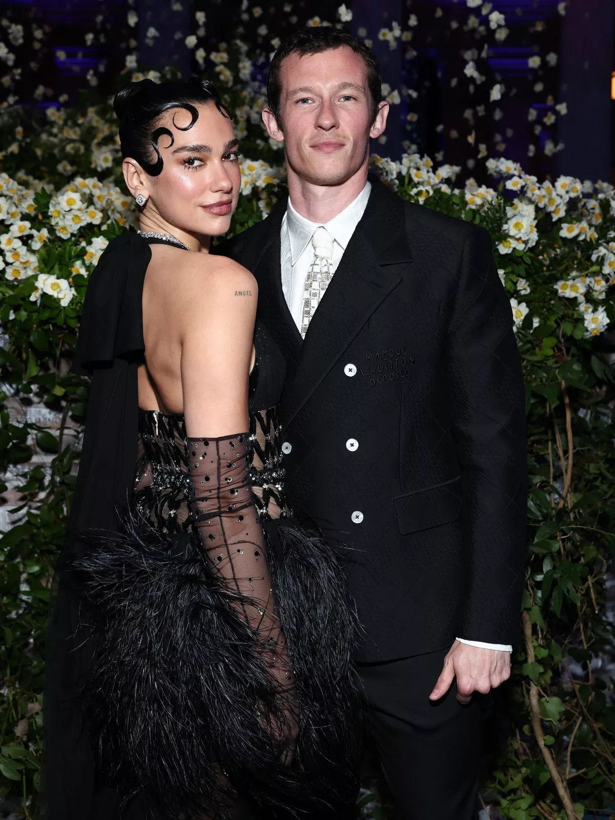 Dua Lipa and Callum Turner attend the 2025 Met Gala Celebrating "Superfine: Tailoring Black Style" at Metropolitan Museum of Art on May 05, 2025 in New York City.