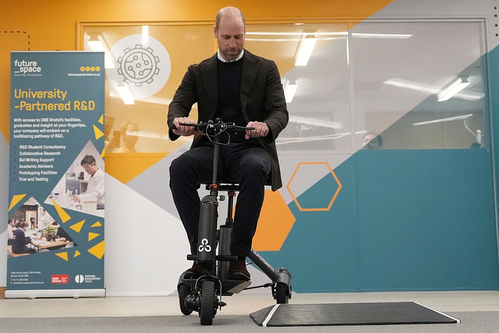 A person rides a specialized mobility scooter.