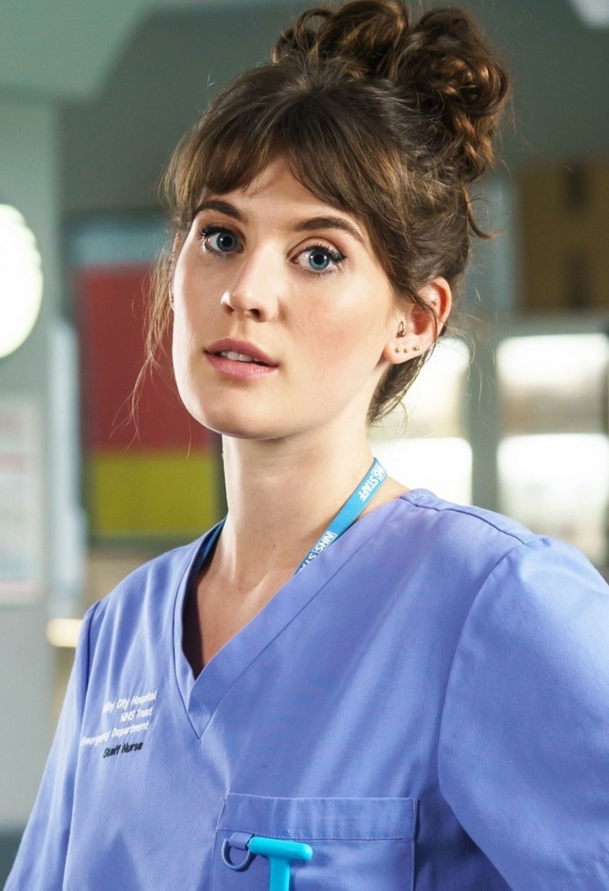 Anna Chell in a blue outfit in a promo photo for Casualty.