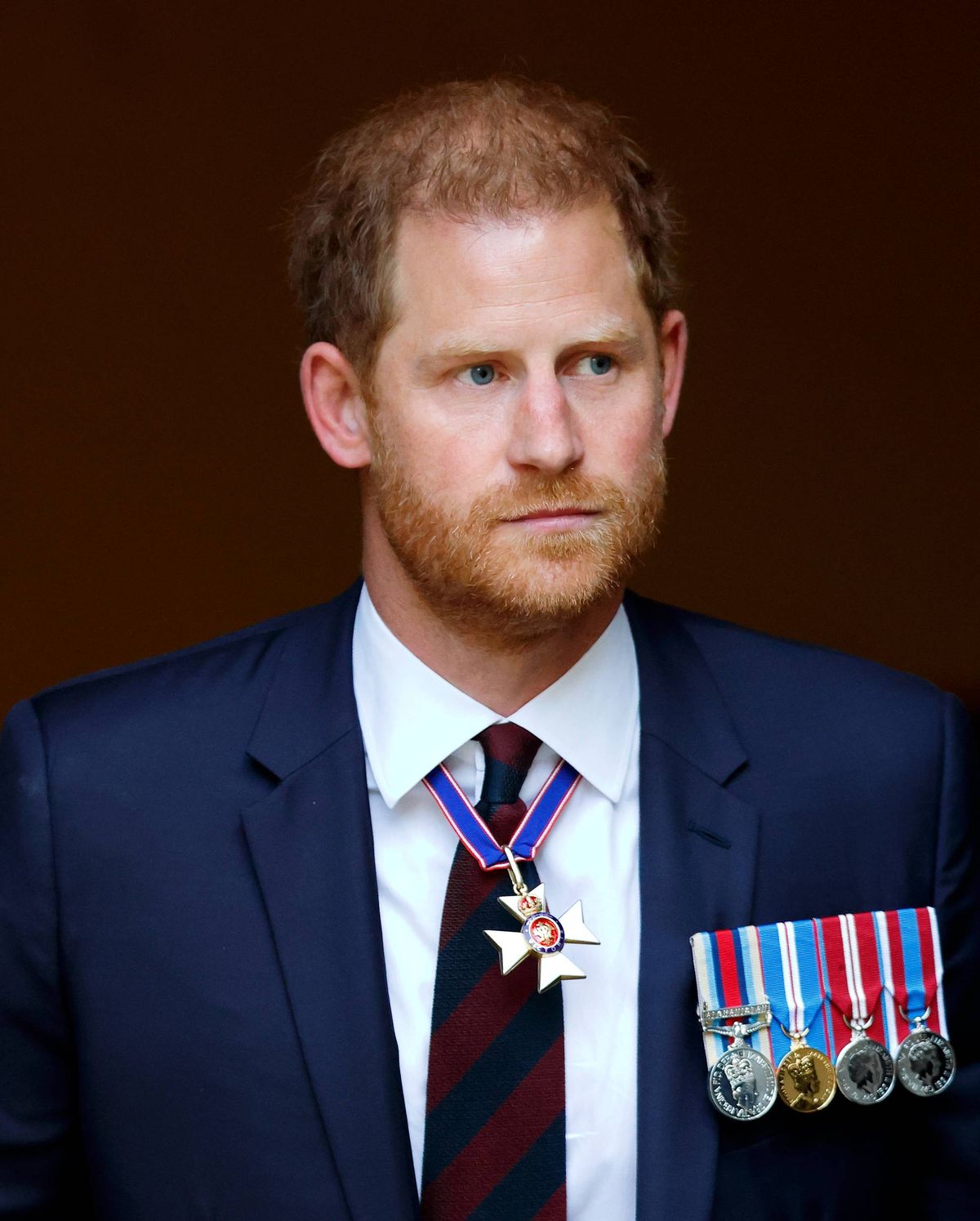 Prince Harry, Duke of Sussex (wearing a Household Division regimental tie and medals including his Knight Commander of the Royal Victorian Order cross) attends The Invictus Games Foundation 