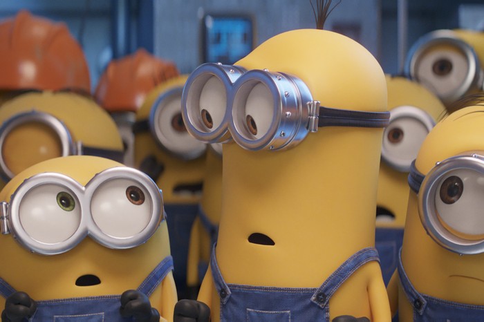 MINIONS: THE RISE OF GRU Minions in Minions: The Rise of Gru looking at each other, concerned