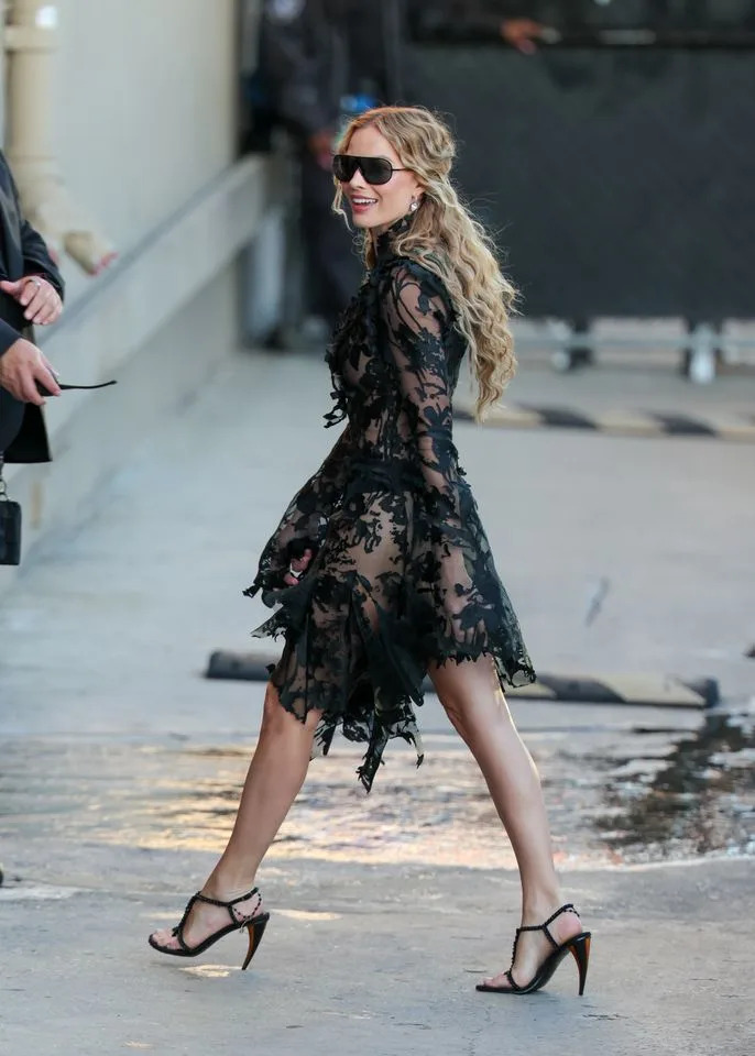 Robbie wore a sheer black lace dress on January 26 Getty
