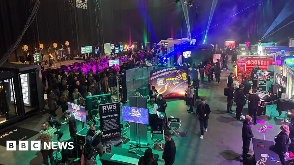 Production Park urges young people to consider creative careers Production Park, filled with young people and screens lit up in multi colours.
