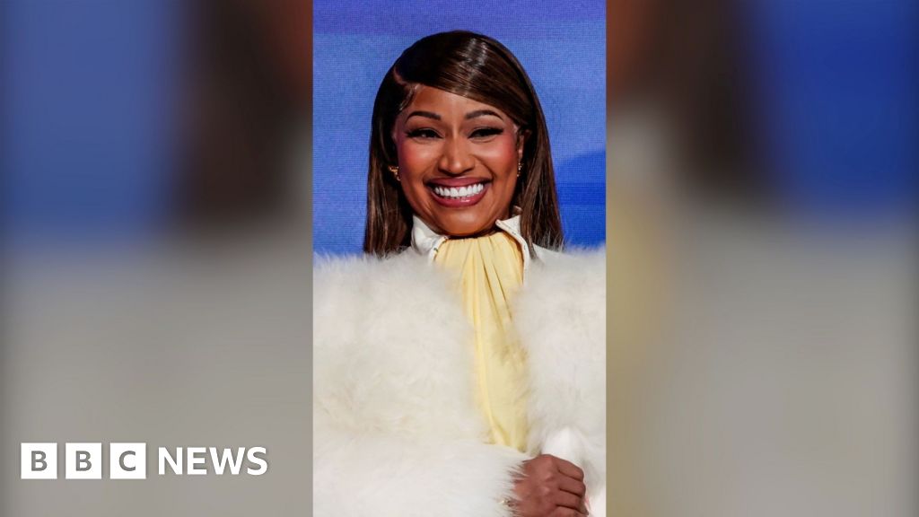 Nicki Minaj: 'I am probably Trump's number one fan' – BBC A woman, Nicki Minaj, smiling wearing a fluffy white jacket.