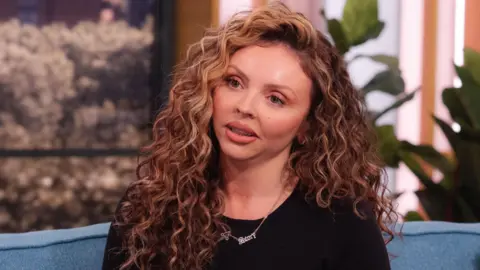 Ken McKay/ITV/Shutterstock Jesy Nelson sitting on the sofa on ITV's This Morning