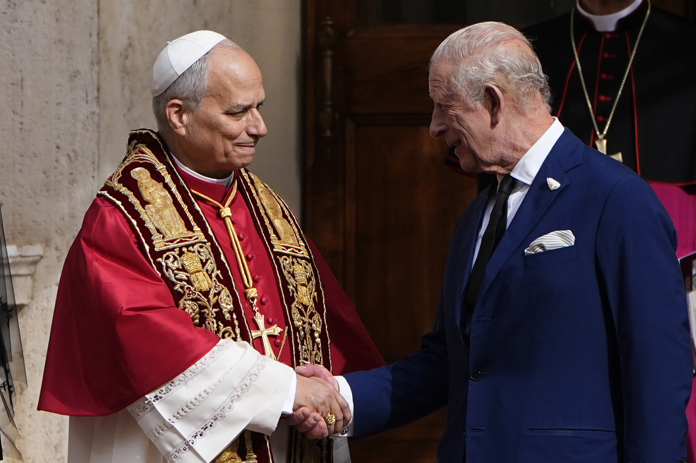 The King shaking hands with the Pope