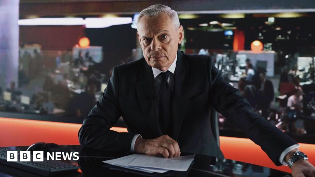 Former BBC presenter Huw Edwards to be played by Martin Clunes in new drama Actor Martin Clunes depicted as former BBC presenter Huw Edwards. Clunes is photographed in character wearing a black suit and silver watch. The actor is sat in a newsroom studio with pieces of paper in front of him and a newsroom with journalists working behind him.