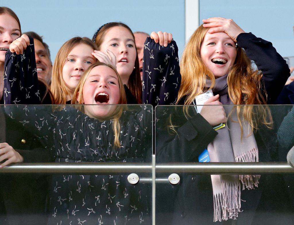 Mia Tindall and Savannah Phillips cheering in stands