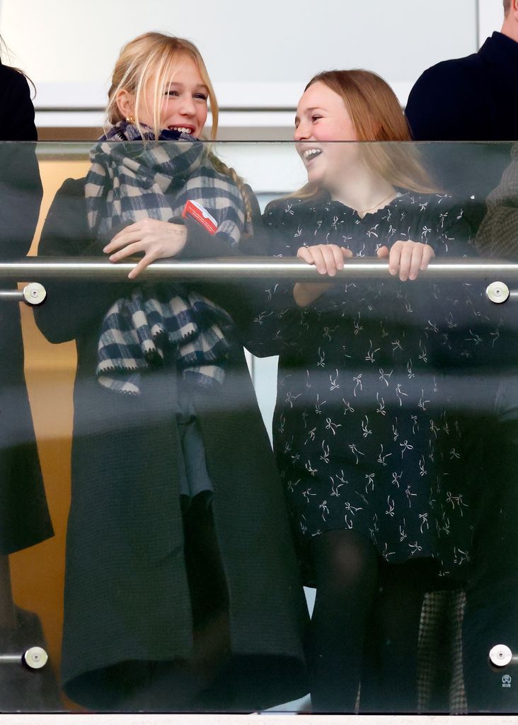 Mia Tindall in stands at racecourse with isla phillips