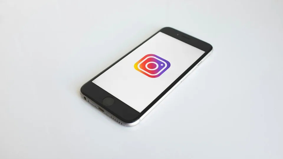 The Instagram app on an iPhone 6. A visual shorthand for the 2016 throwback wave. Credit: Kenny Eliason, via Unsplash.