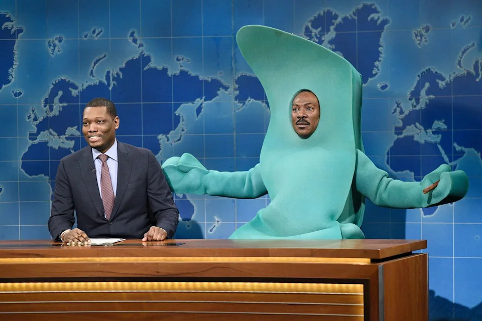 Will Heath/NBC/NBCU Photo Bank via Getty Michael Che with 'SNL' host Eddie Murphy as Gumby during 'Weekend Update' on Dec. 21, 2019