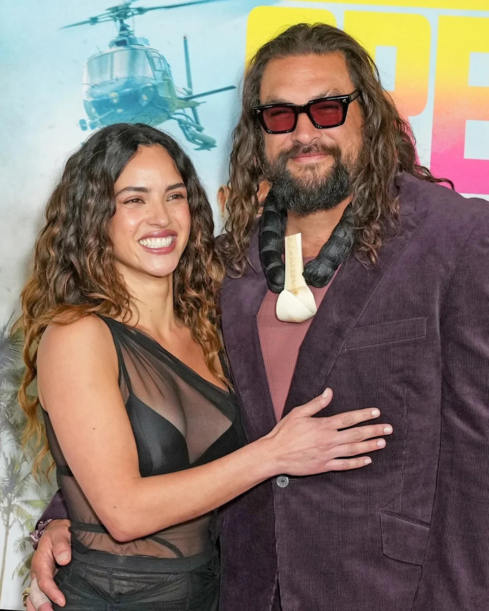 Jason Momoa and Adria Arjona share a romantic moment at the New York City premiere of Momoa’s new action-comedy, The Wrecking Crew.