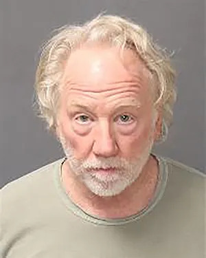 Timothy Busfield in a police booking photo. 