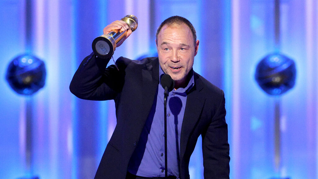 Stephen Graham accepts the Best Actor in a Limited Series, Anthology Series, or Motion Picture Made for Television Award for Adolescence onstage from Melissa McCarthy onstage during the 83rd Annual Golden Globe Awards at The Beverly Hilton on January 11, 2026 in Beverly Hills, California.