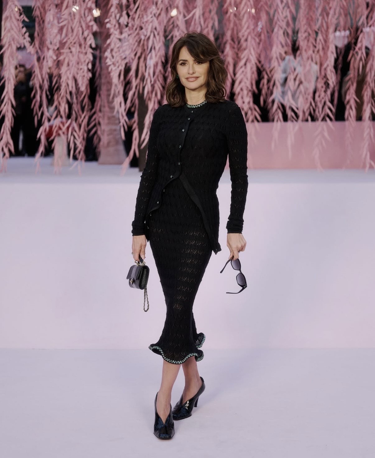 Penélope Cruz in a black Chanel knit set at Paris Haute Couture Week, embodying refined haute couture week outfits with timeless appeal