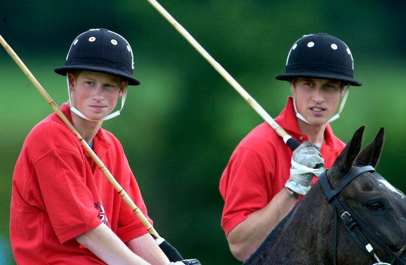 Prince Harry and Prince William take part in a charity polo match on July 13, 2002 in Tidworth, England.