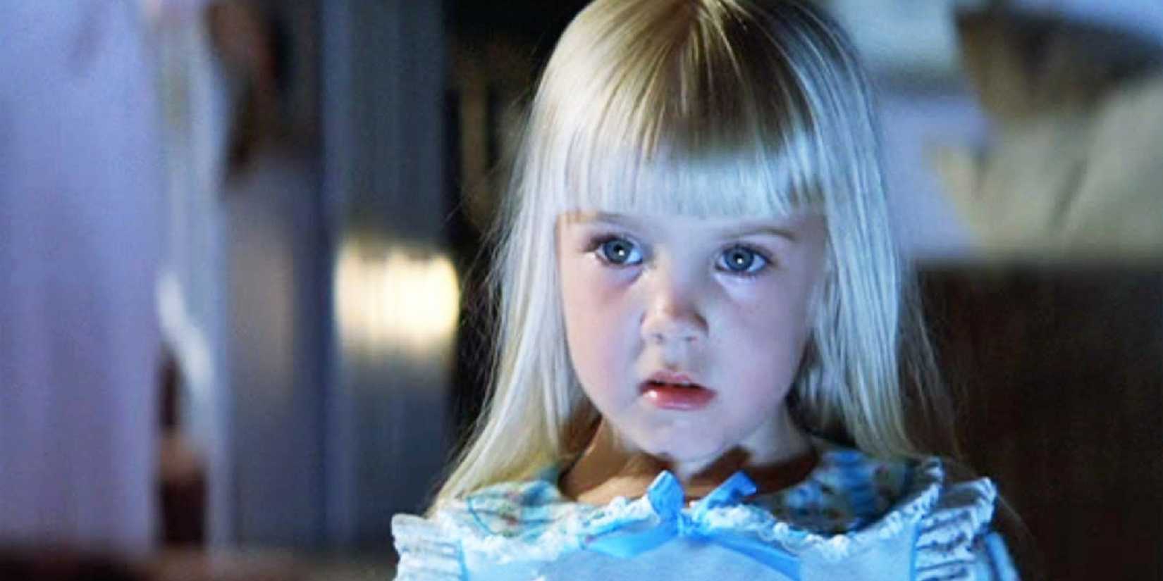 Carol Anne looking at the television in Poltergeist.