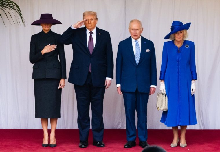 WINDSOR, ENGLAND - SEPTEMBER 17: First Lady Melania Trump, US President Donald Trump, King Charles III and Queen Camilla during the State visit by the President of the United States of America at Windsor Castle on September 17, 2025 in Windsor, England. (Photo by Photo by Zak Hussein - Pool via Samir Hussein/WireImage)