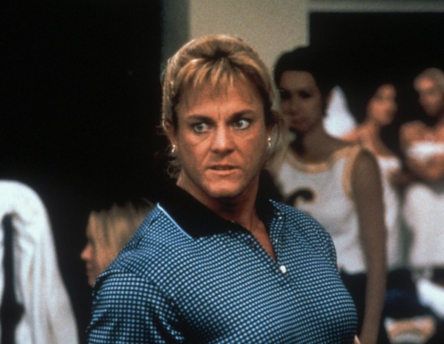 A scene from Scary Movie with Jayne Trcka wearing a checkered top.