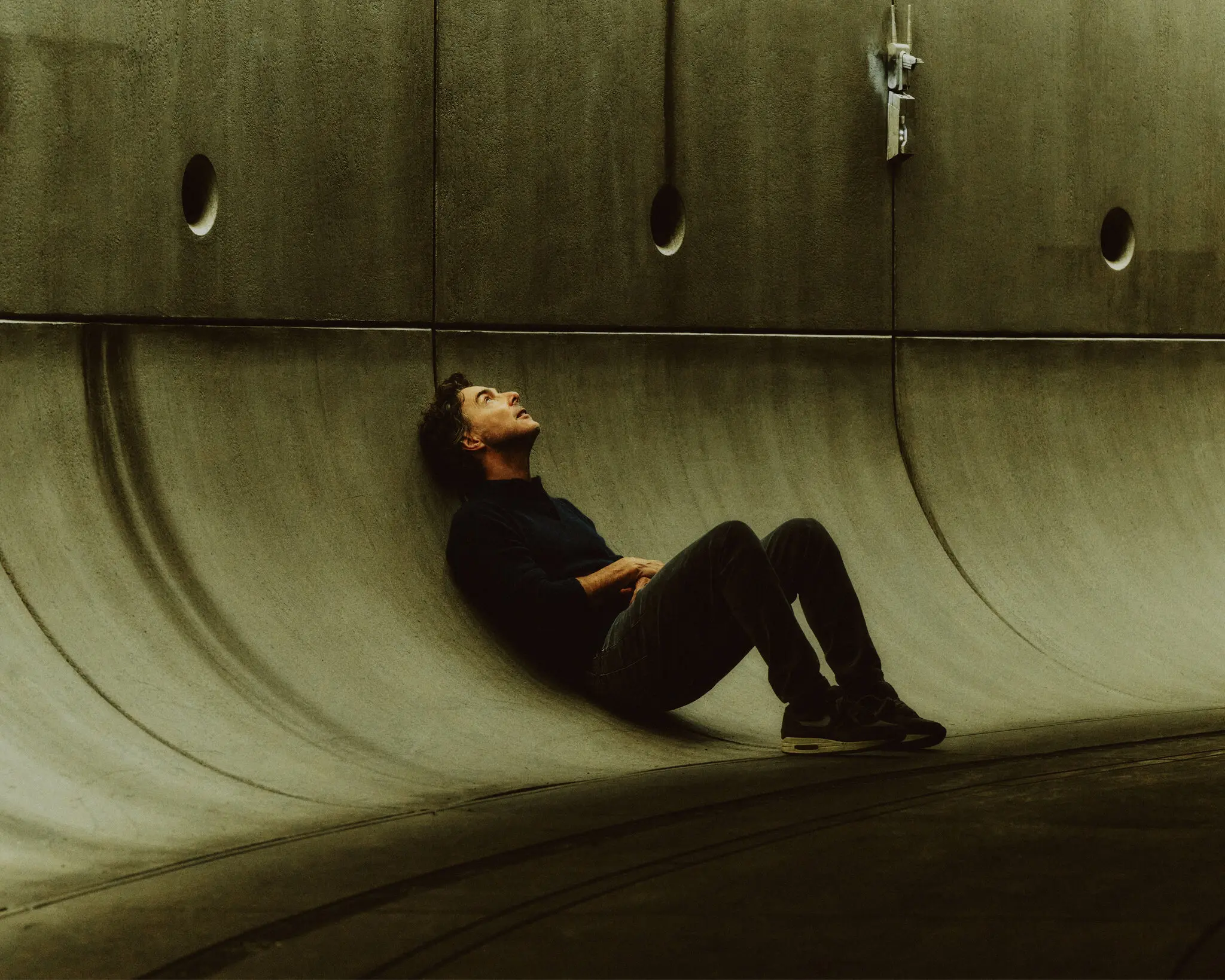 Shawn Levy sitting against Star Wars set in a photoshoot