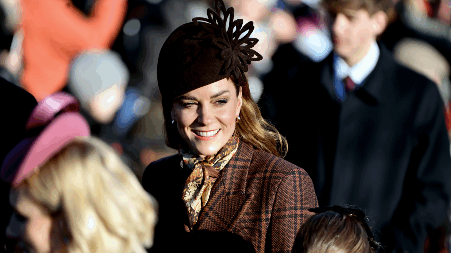 Princess Kate’s 44th Birthday Gifts Will Range From “Hand-Me-Downs” to “Silly Presents” Princess Kate smiling, wearing a brown plaid coat and brown hat