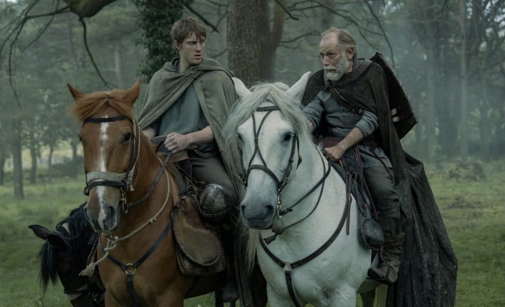 Dunk (Peter Claffey) and Ser Arlan of Pennytree (Danny Webb) sitting on their horses in A Knight of the Seven Kingdoms
