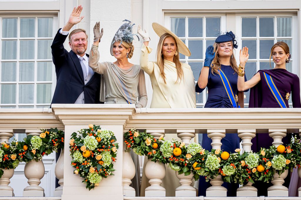 King Willem-Alexander, Queen Maxima, Princess Catharina-Amalia, Princess Ariane and Princess Alexia waving from a balcony