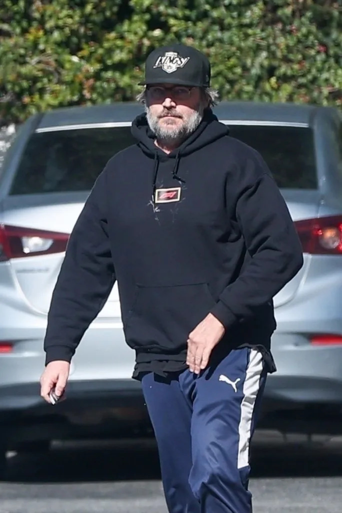 Vartan dressed casually in a black hoodie and Puma pants. BACKGRID