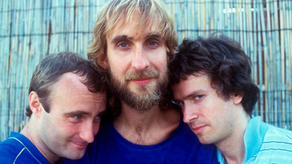 Turn It On Again by Genesis: the story behind the song Genesis posing for a photograph in 1980