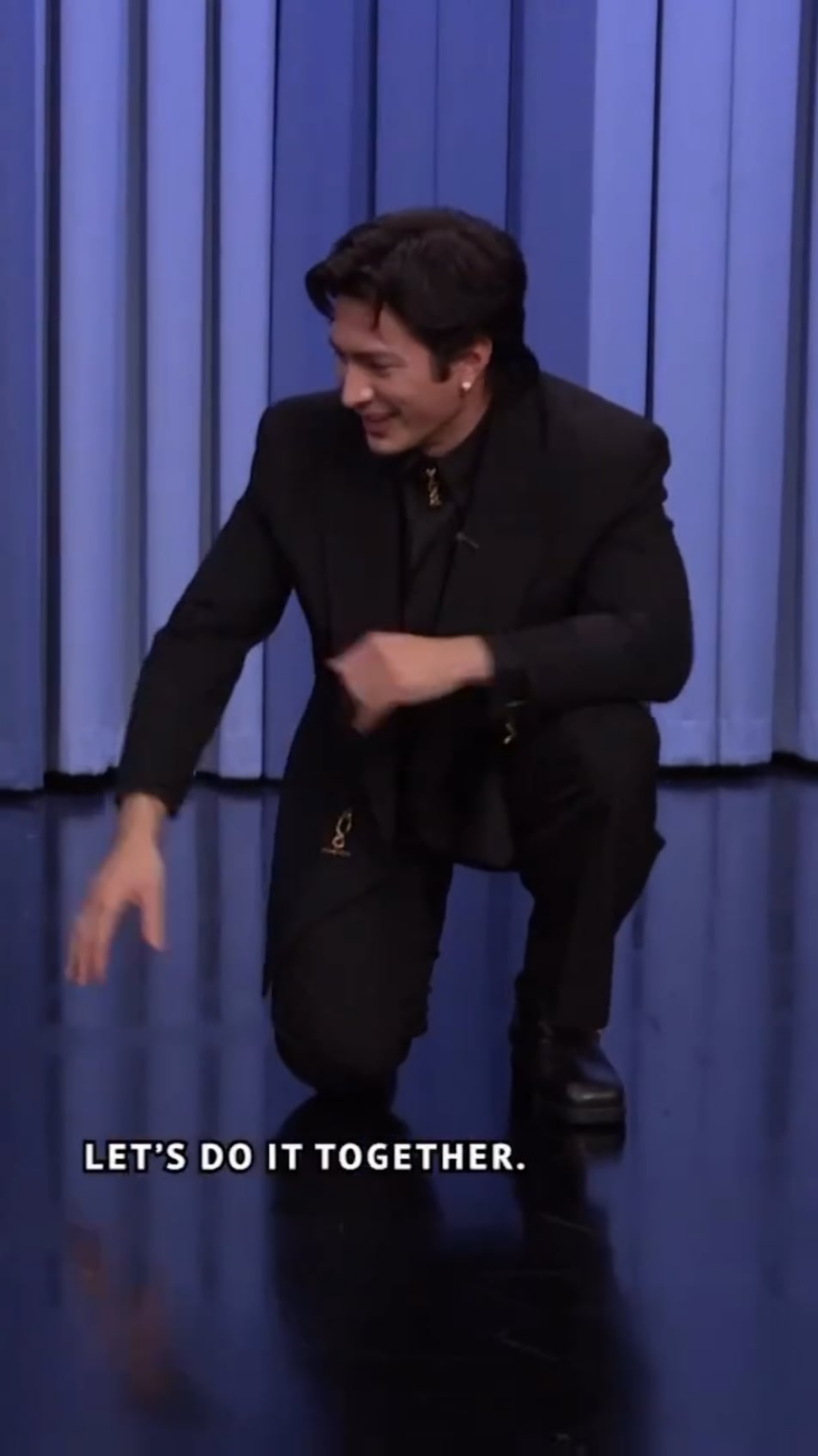 Hudson Williams doing the Shane Hollander inspired hockey stretch at The Tonight Show Starring Jimmy Fallon