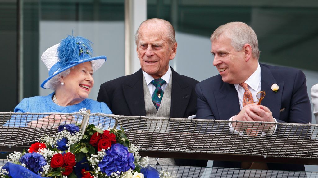 Queen Elizabeth II, Prince Philip, Duke of Edinburgh and Prince Andrew watch the racing from the balcony of the Royal Box as they attend Derby Day during the Investec Derby Festival at Epsom Racecourse on June 4, 2016 in Epsom, England. 
