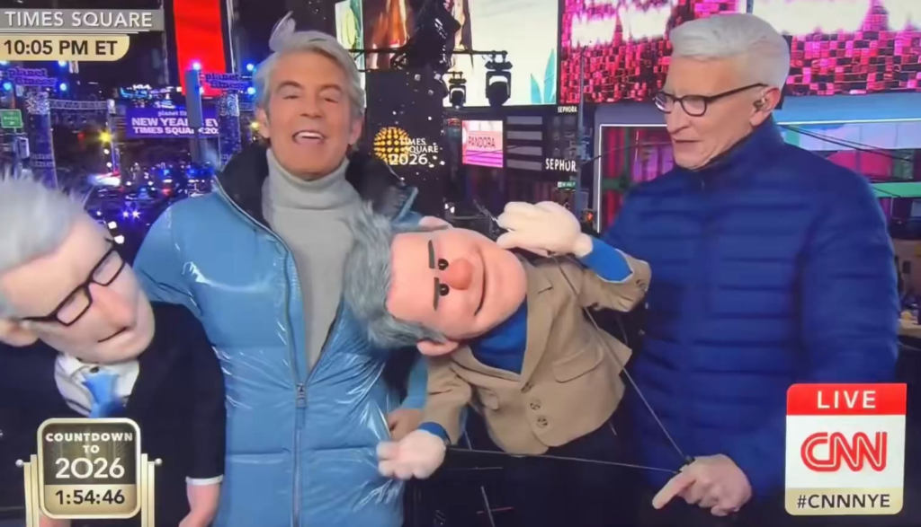 Anderson Cooper and Andy Cohen arguing over whether Anderson spent his childhood in puppetry school during New Year’s 2026