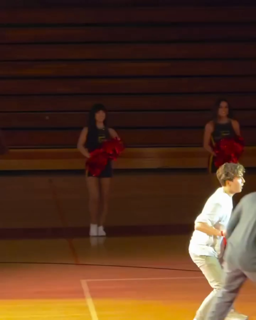 Timothée Chalamet and Adam Sandler hooping against two Fairfax High School students