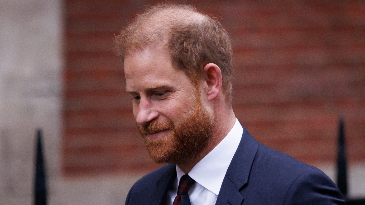 Prince Harry “Fought Back Tears” in Court, Says He Was “Conditioned” by Royal Family to “Accept” Negative Press Prince Harry wearing a suit and tie