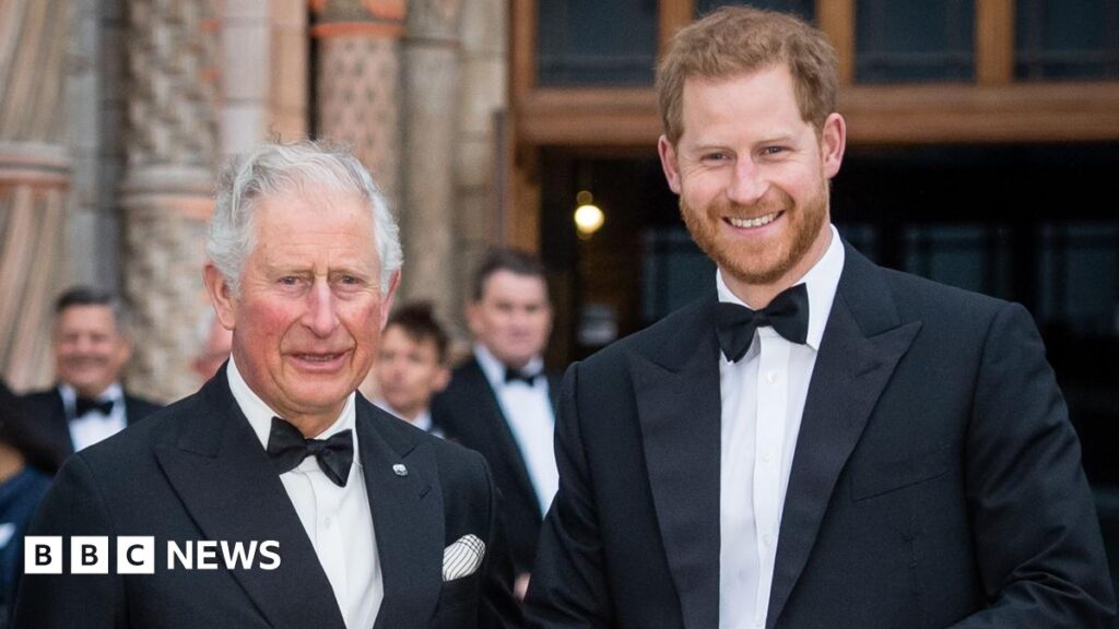 Head and shoulders pics of then Prince Charles and Prince Harry in London in 2019. They are both wearing tuxedos and smiling at the camera. Harry is on the right