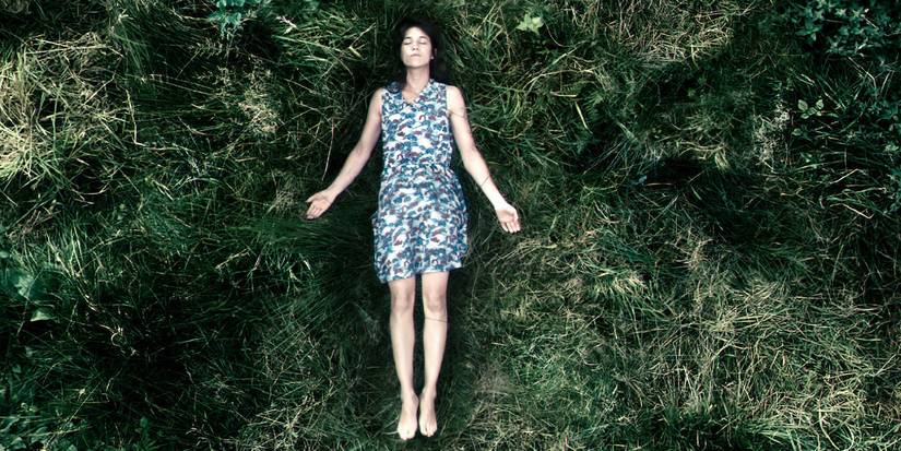 Charlotte Gainsbourg lying on the grass in Antichrist
