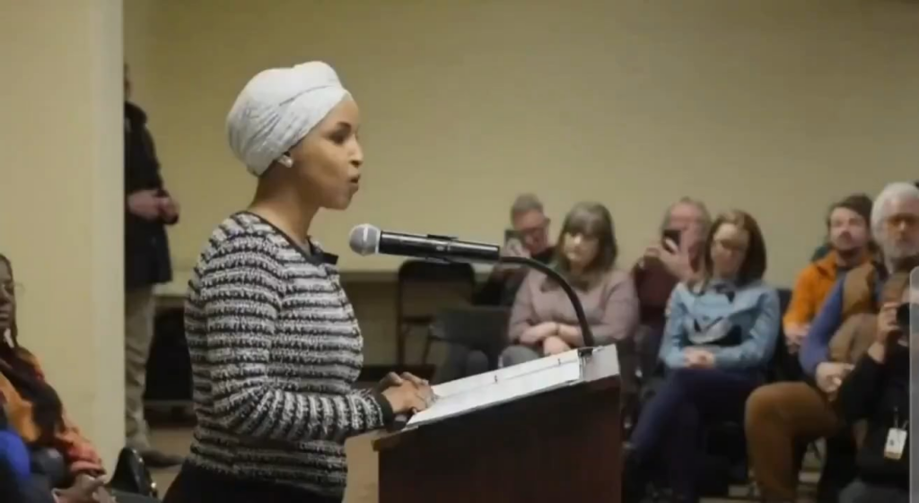 A man was tackled to the ground earlier today after spraying an unknown substance on Rep. Ilhan Omar at a town hall in Minneapolis.
