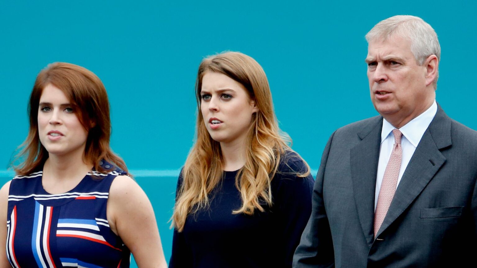 Princess Beatrice Joined Ex-Prince Andrew for a Horseback Ride Princess Eugenie and Princess Beatrice wear striped dresses as they walk with their father Prince Andrew, who is wearing a dark suit with a pink tie