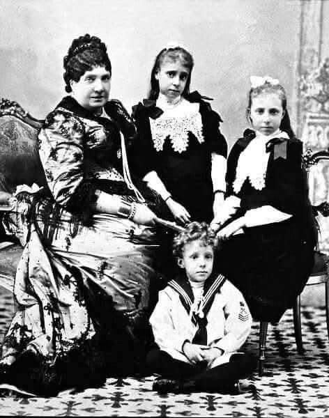 Queen Elizabeth II of Spain (1830-1904) with her grandchildren, Maria de las Mercedes (1880-1904), Maria Teresa (1882-1912), Alfonso XIII (1886-1941)