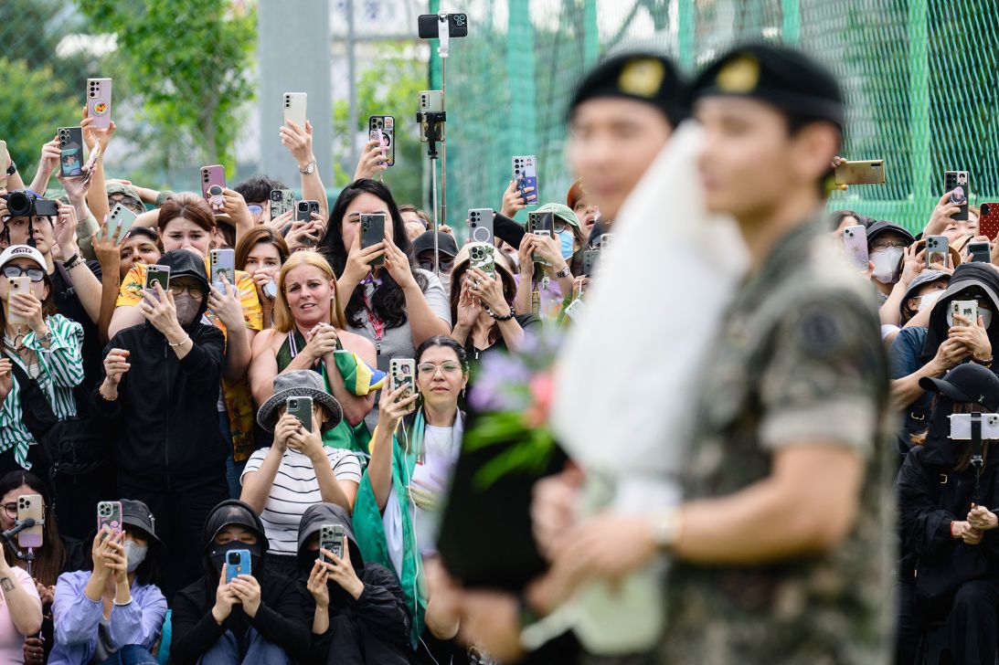 Hundreds of fans gathered near two army bases just outside the capital Seoul where RM and V were discharged.