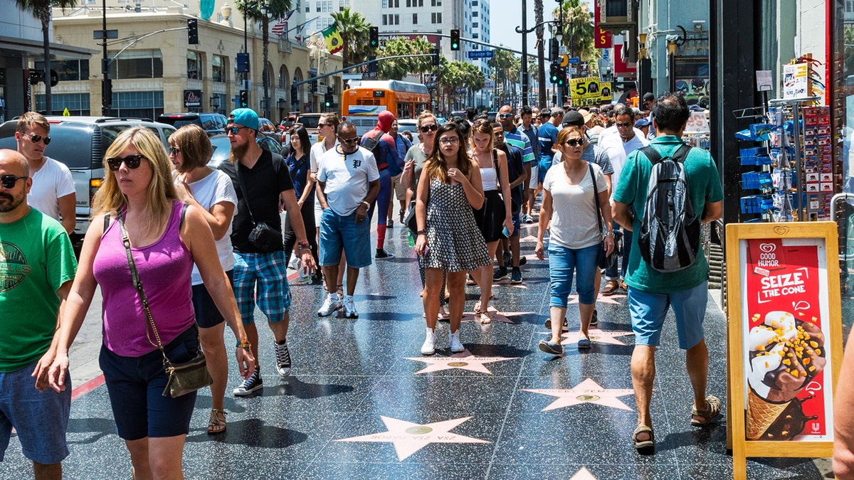 crowds on Hollywood Walk of Fame on Hollywood Boulevard in Los Angeles California