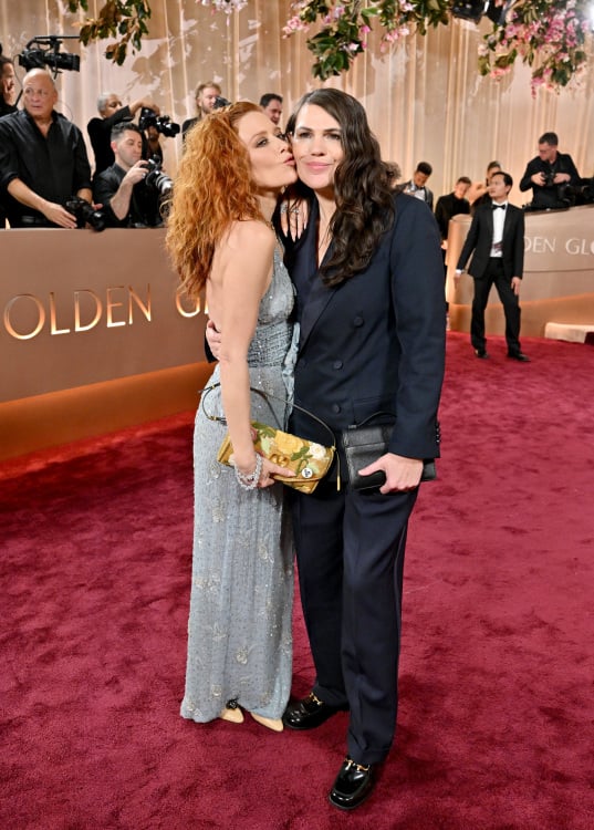 Natasha Lyonne kisses the cheek Clea DuVall on the red carpet.