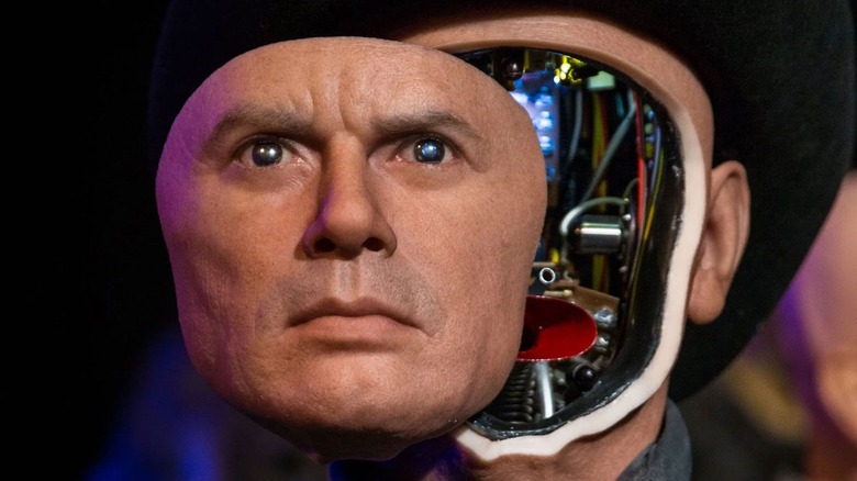 Yul Brynner as the Gunslinger with his face partially removed to reveal the robot insides in Westworld